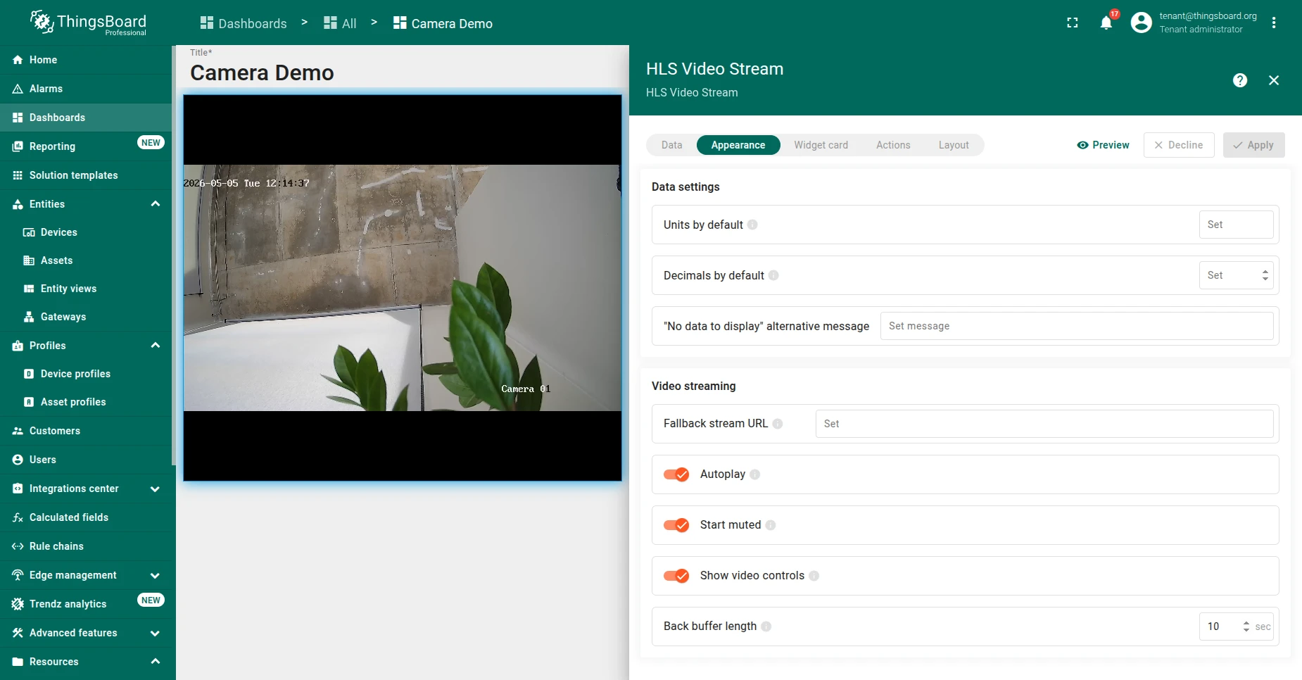 HLS Video Stream widget edit panel on the Appearance tab. The Video streaming section shows the Fallback stream URL field, Autoplay, Start muted, Show video controls toggles, and the Back buffer length field set to 10 seconds. The dashboard preview on the left plays a live HLS feed.