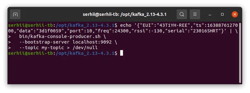 Terminal running kafka-console-producer.sh, piping a JSON test record to the my-topic topic on localhost:9092
