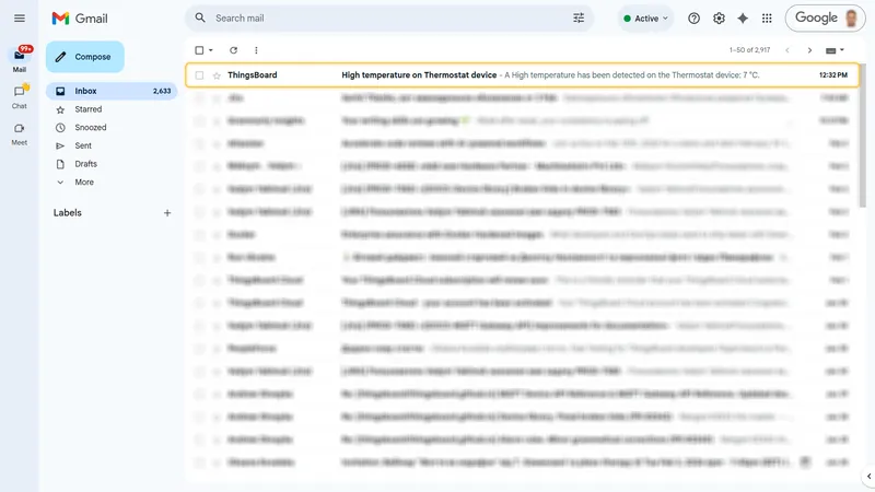 Gmail inbox showing an unread email from ThingsBoard with subject "High temperature on Thermostat device" and a preview of the message body