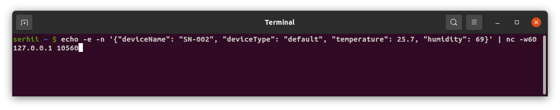Terminal — JSON message sent; connection kept open with -w60 to receive a downlink response